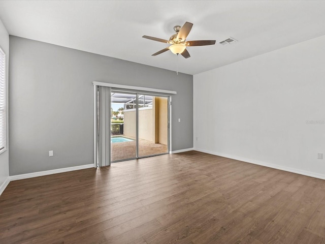 unfurnished room featuring ceiling fan and dark hardwood / wood-style floors