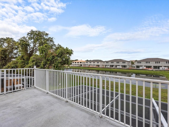 balcony featuring a water view