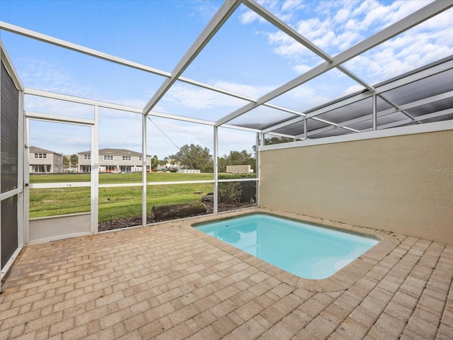 view of pool featuring a patio area and a yard