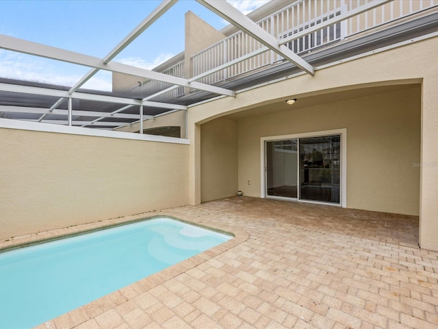 view of pool with a lanai and a patio area