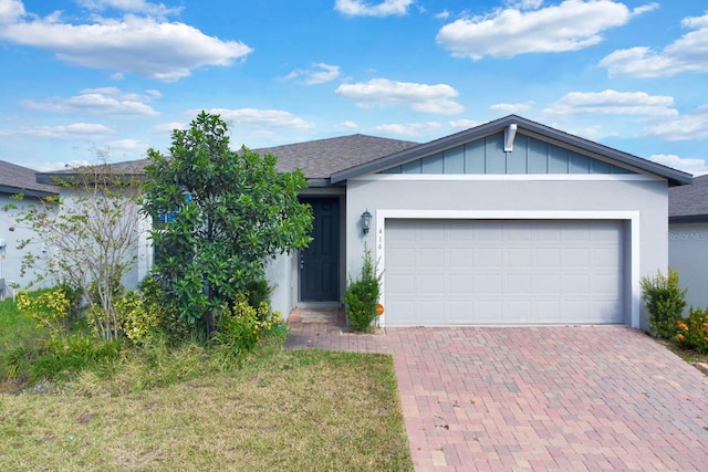 ranch-style home with a garage