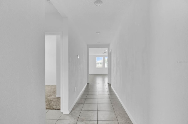 corridor with light tile patterned floors