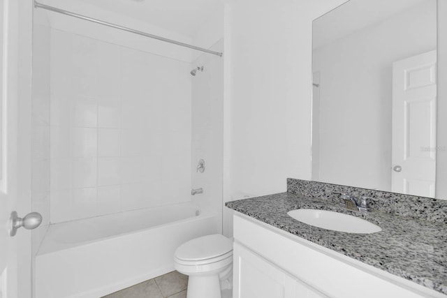 full bathroom with tile patterned floors, vanity, toilet, and tiled shower / bath combo