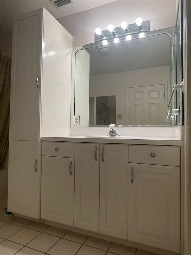 bathroom featuring vanity and tile patterned floors