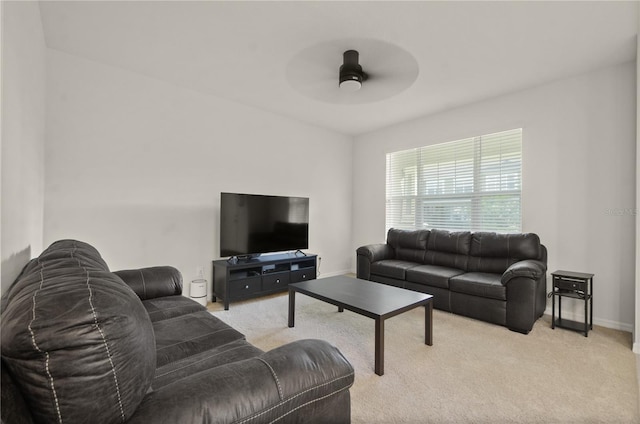 carpeted living room featuring ceiling fan