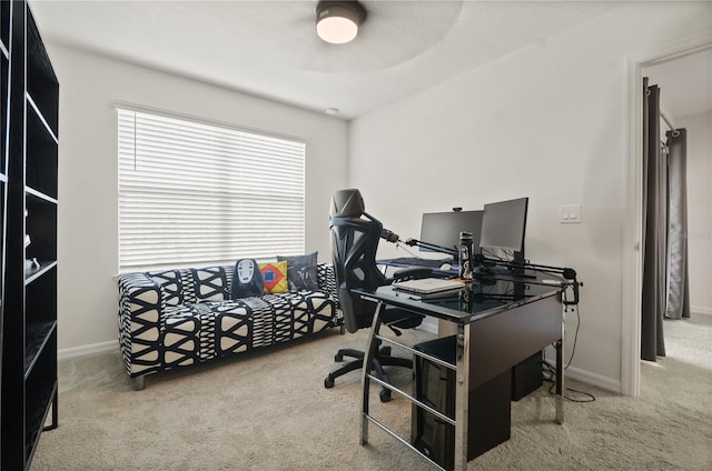 office with carpet flooring and ceiling fan