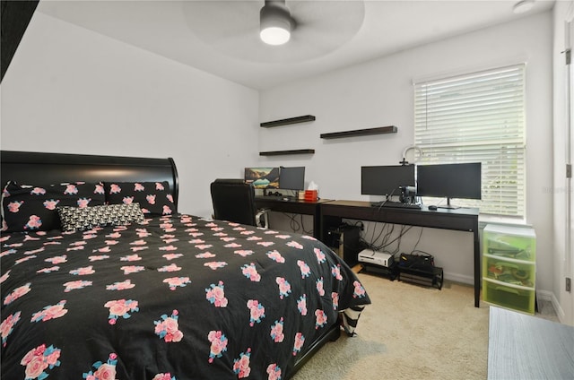 bedroom featuring ceiling fan and light colored carpet