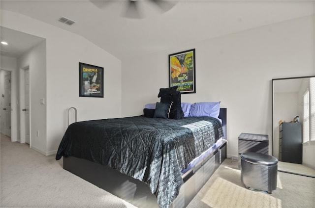 carpeted bedroom featuring ceiling fan and vaulted ceiling