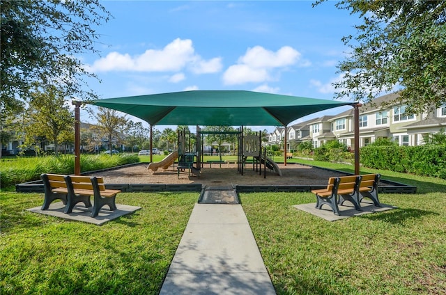 view of jungle gym with a lawn