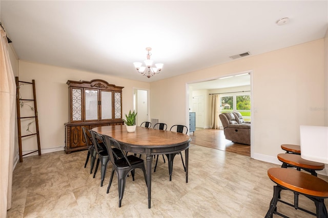 dining area featuring a chandelier