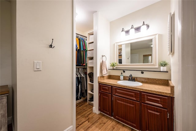 bathroom featuring hardwood / wood-style flooring and vanity