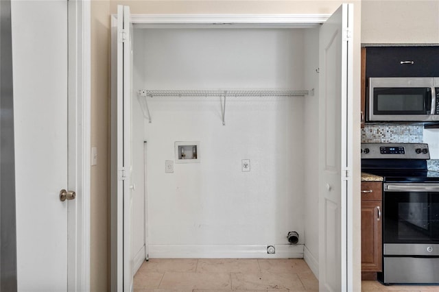 clothes washing area with hookup for an electric dryer, washer hookup, light tile patterned flooring, and hookup for a gas dryer