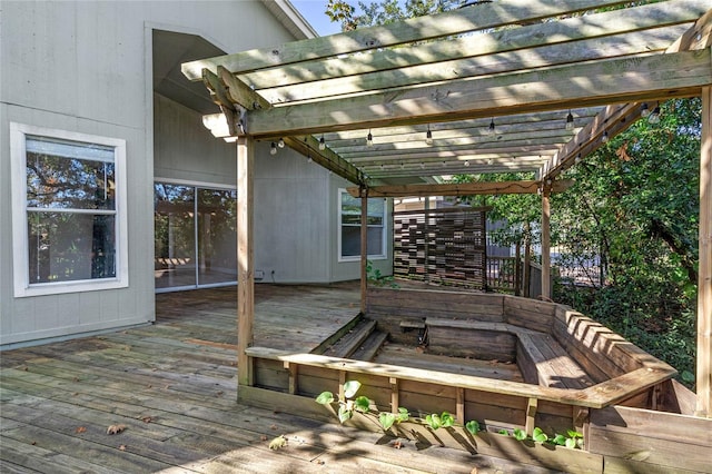 wooden deck featuring a pergola