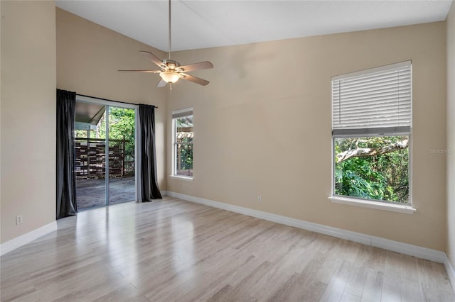 unfurnished room featuring wood finished floors, baseboards, and a ceiling fan