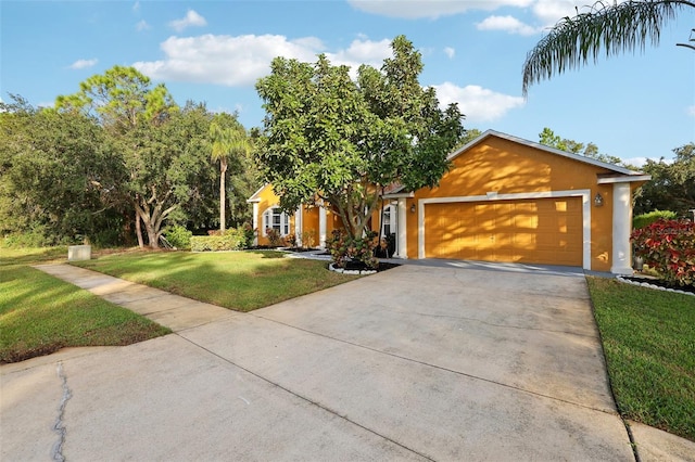 view of front of house with a front yard and a garage