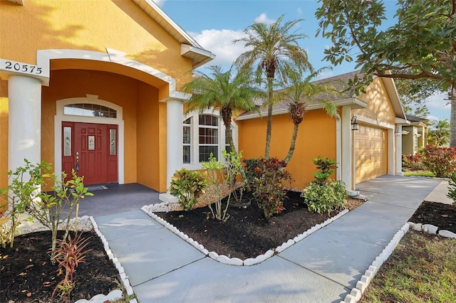 doorway to property featuring a garage