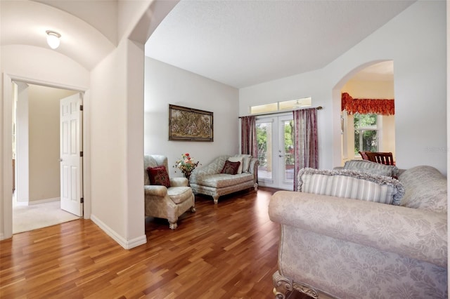 living room featuring hardwood / wood-style flooring and french doors