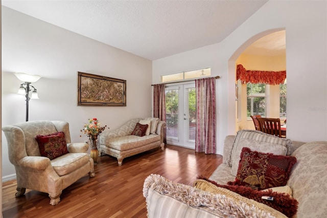 sitting room with hardwood / wood-style flooring and french doors