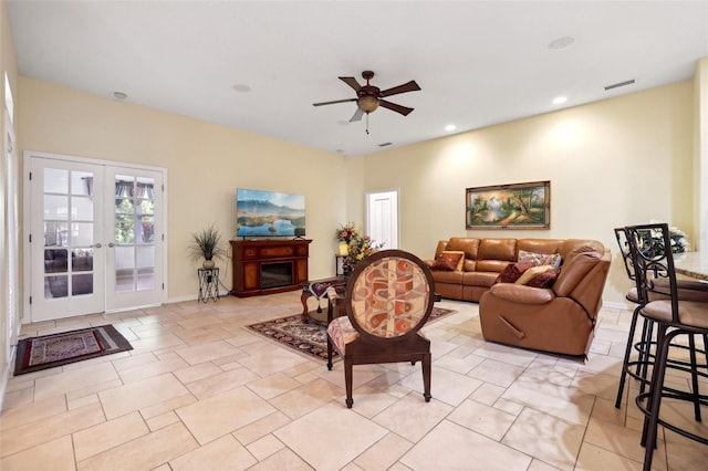 living room with ceiling fan and french doors