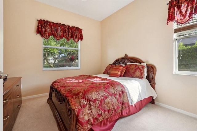 bedroom with light carpet