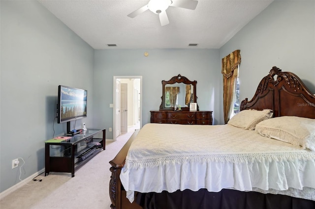 carpeted bedroom with a textured ceiling and ceiling fan