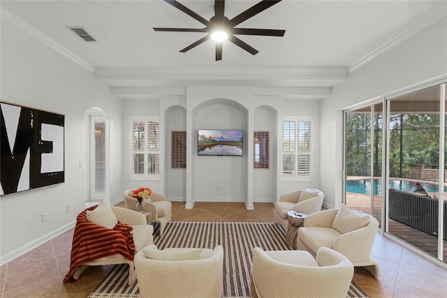 living room featuring light tile patterned floors, ceiling fan, and ornamental molding