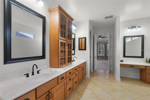 bathroom featuring tile patterned floors, ceiling fan, and vanity