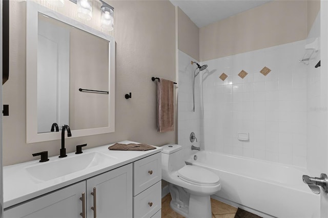 full bathroom with tile patterned floors, toilet, vanity, and tiled shower / bath