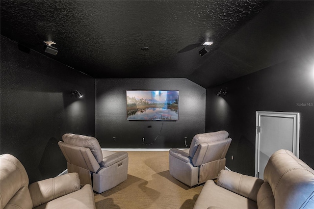 carpeted cinema featuring a textured ceiling, ceiling fan, and lofted ceiling