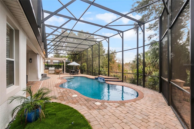 view of swimming pool with a lanai and a patio