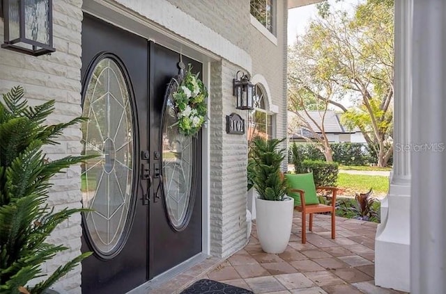 view of exterior entry featuring french doors