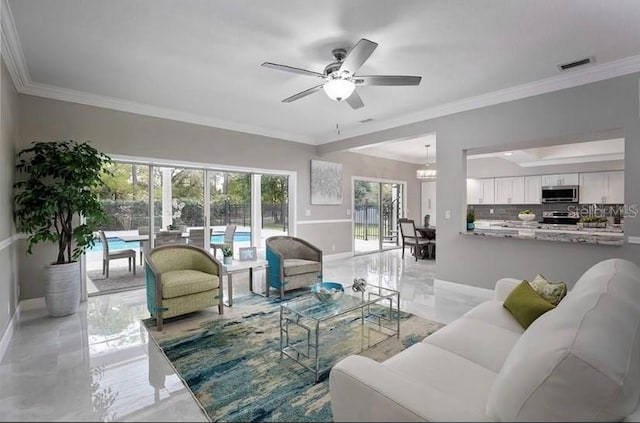 living room featuring ceiling fan with notable chandelier and ornamental molding