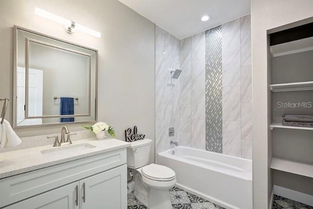 full bathroom featuring vanity, toilet, and tiled shower / bath