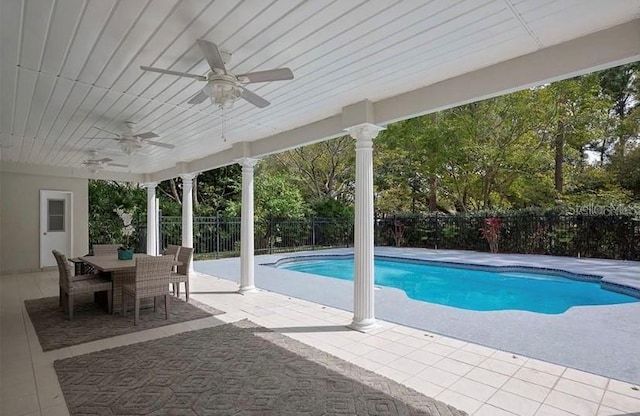 view of pool with ceiling fan and a patio area