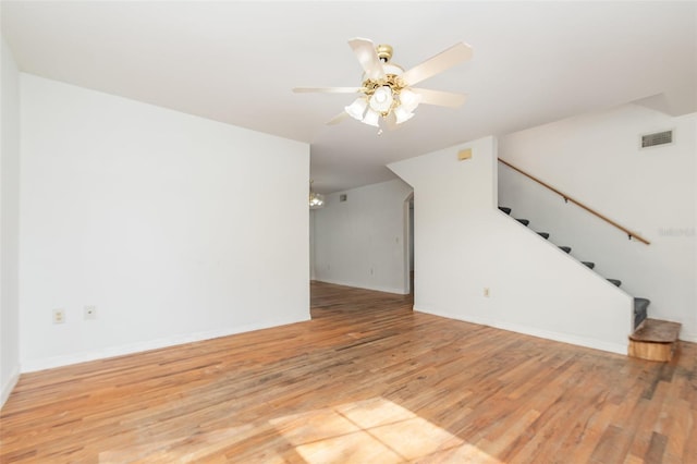 unfurnished living room featuring light hardwood / wood-style flooring and ceiling fan