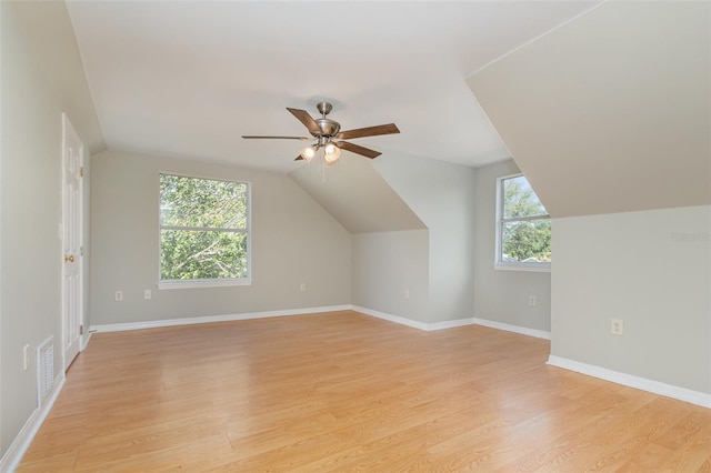 bonus room featuring light wood-type flooring, vaulted ceiling, and ceiling fan