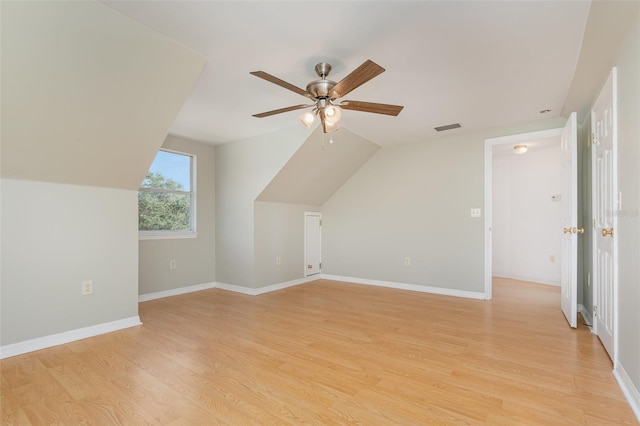 additional living space with light hardwood / wood-style flooring, ceiling fan, and lofted ceiling