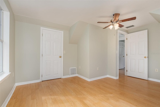 empty room featuring ceiling fan and light hardwood / wood-style flooring