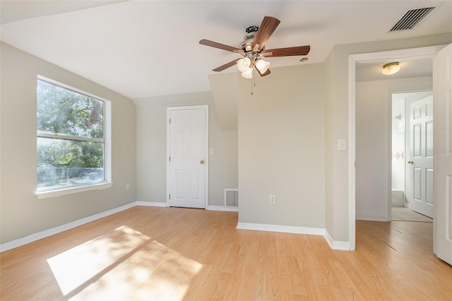 empty room with light wood-type flooring and ceiling fan