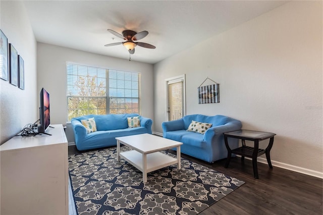 living room with dark hardwood / wood-style floors and ceiling fan