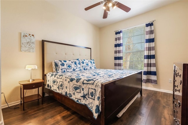 bedroom featuring ceiling fan and dark wood-type flooring