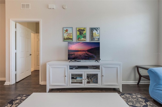 living room with dark hardwood / wood-style floors