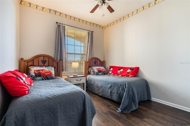 bedroom featuring dark hardwood / wood-style flooring and ceiling fan