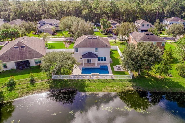 birds eye view of property with a water view