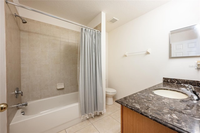 full bathroom with vanity, shower / bath combination with curtain, tile patterned flooring, toilet, and a textured ceiling