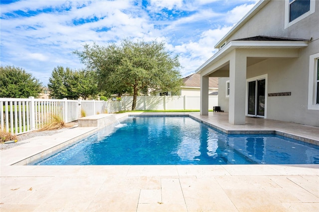 view of swimming pool with a patio area