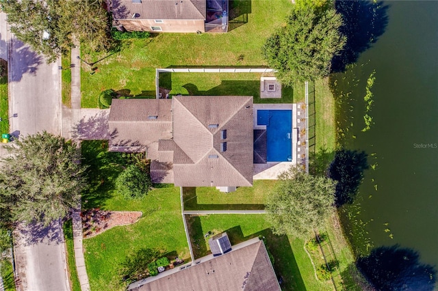 birds eye view of property with a water view