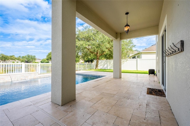 view of swimming pool with a patio