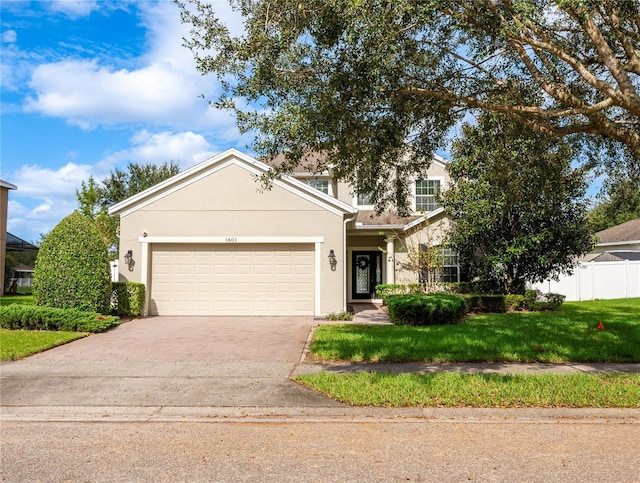 view of front facade featuring a garage and a front yard