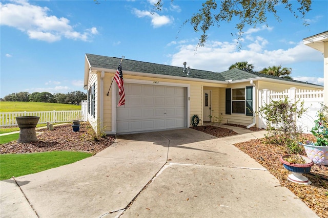 single story home featuring a garage